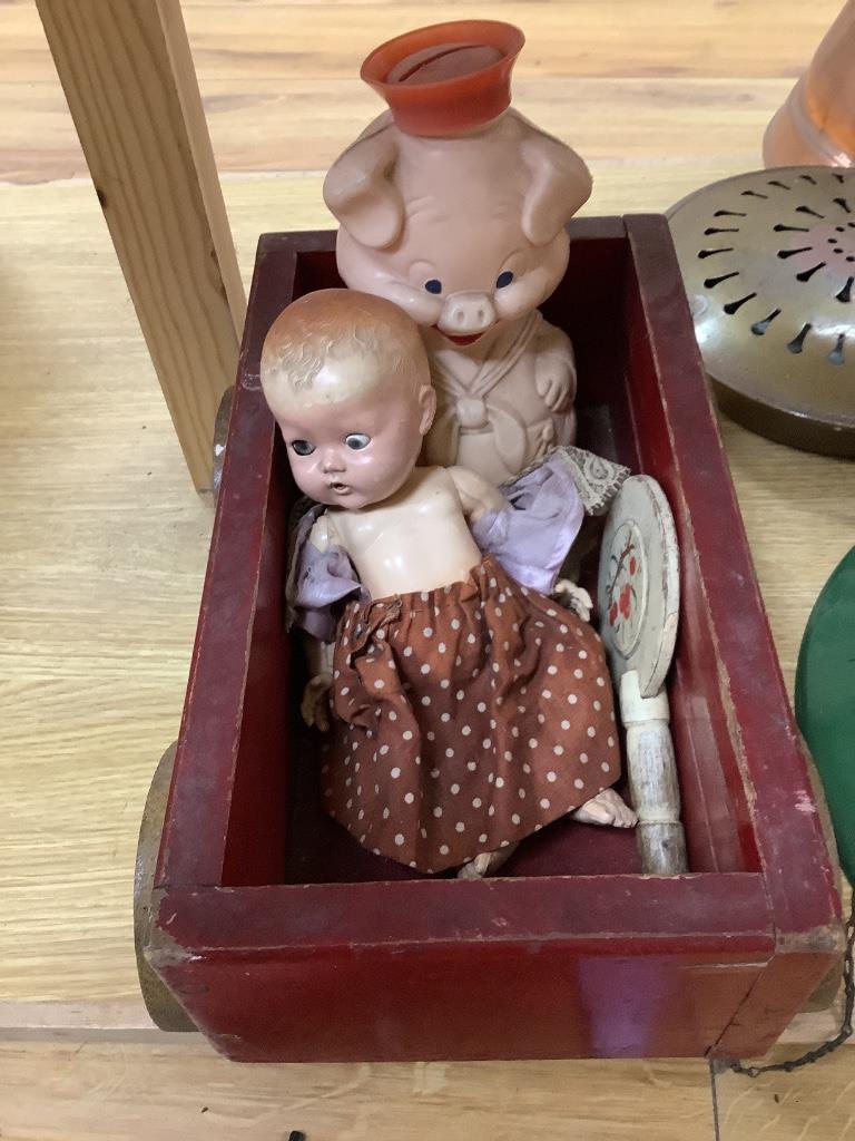 A vintage wooden truck, dolls, a children's sewing machine and other toys etc